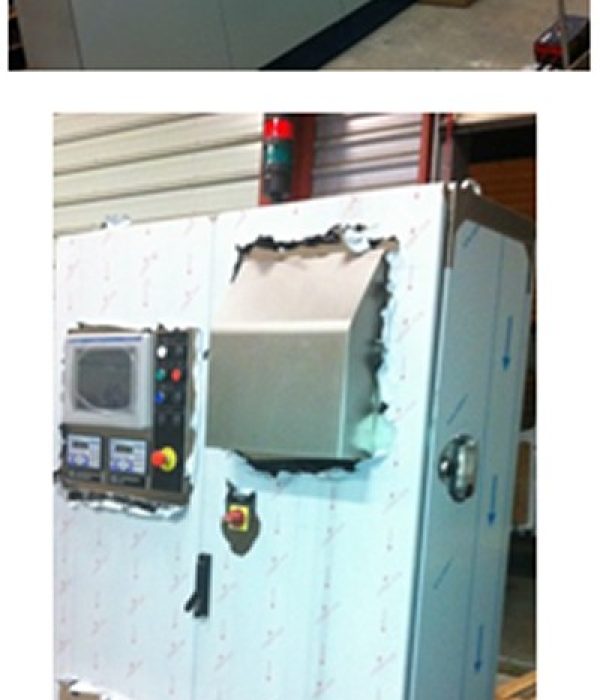 Row of gray electrical cabinets with handles in a workshop setting (informational image).